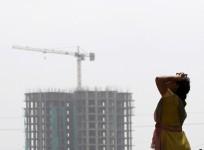 demonetisation construction real estate developer companies outlook fitch ratings sobha prestige puravankara dlf godrej india sensex grade