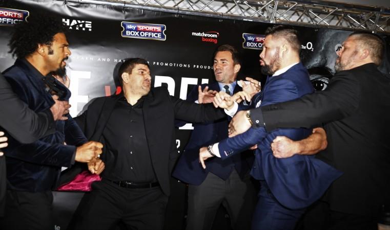 David Haye and Tony Bellew clash after the press conference as promoter Eddie Hearn looks on at the Dorchester Hotel London on Wednesday boxing