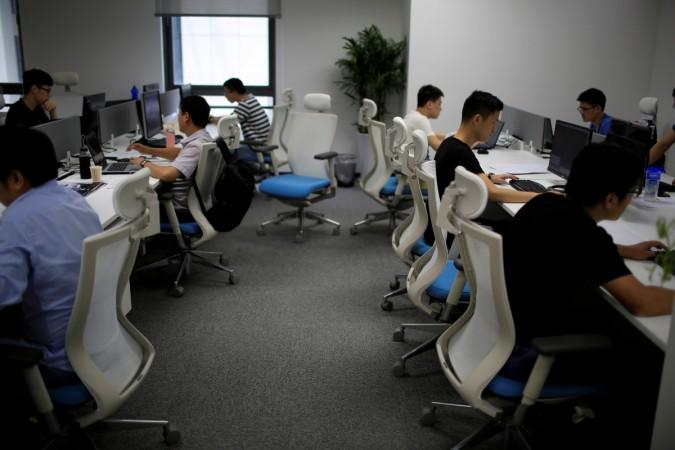 Employees of WM Motor Technology Co., Ltd. work at their office in shanghai, China, August 1, 2016. (Representational Image) employees