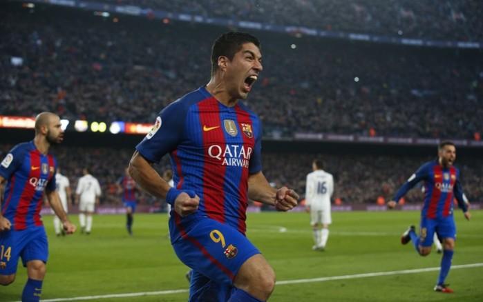 Barcelona forward Luis Suarez celebrates after scoring against Real Madrid Luis Suarez Barcelona