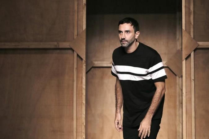Italian designer Riccardo Tisci appears at the end of his Spring/Summer 2015 women's ready-to-wear collection for fashion house Givenchy during Paris Fashion Week September 28, 2014. Riccardo Tisci