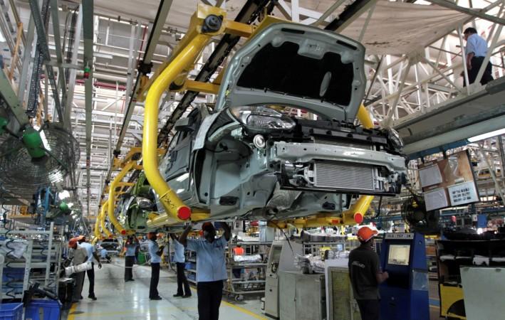 Workers assemble Ford cars at a plant of Ford India in Chengalpattu on the outskirts of Chennai, India March 5, 2012. Tamil Nadu J Jayalalithaa Assembly polls elections health apollo hospital cardiac arrest industry growth gsdp factories ford hyundai renault ashok leyland