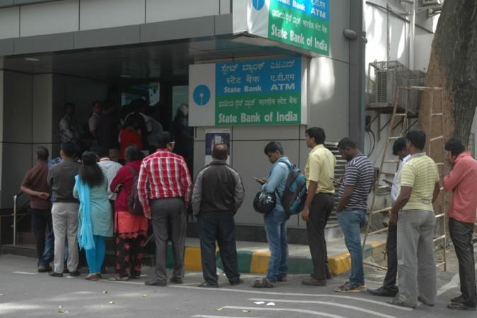 demonetisation raids karnataka corruption fraud notes banks bureaucrats raids income tax acb police bengaluru exchange commission nexus contractors