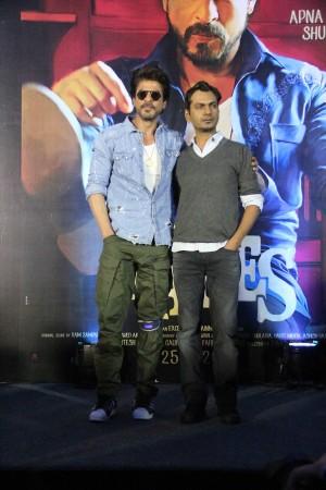 Shah Rukh Khan (with his knee cap on) and Nawazuddin Siddiqui at the Raees trailer launch. Shah Rukh Khan