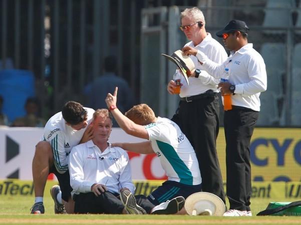 The England physio attends to umpire Paul Reiffel after accidentally being hit on the head by the ball, December 8, 2016 Paul Reiffel Umpire