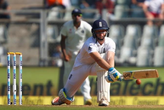England batsman Jos Buttler plays a reverse-sweep during his half-century against India in the fourth Test, December 9, 2016 Jos Buttler England India