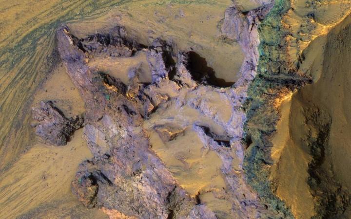 A colorful underlying bedrock discovered in the Ganges Chasma, which is present on the Eastern end of Mars' Valles Marineris valley. A colorful underlying bedrock discovered