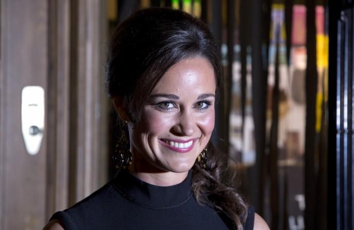 Pippa Middleton, sister of Catherine, Duchess of Cambridge, poses for photographers to promote her first book Pippa Middleton