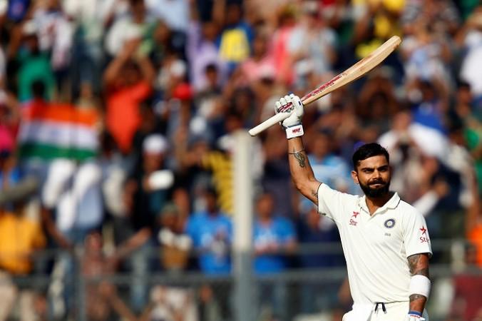India captain Virat Kohli raises his bat after completing a century of the highest order Virat Kohli India England