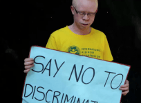 Why does albinism occur?