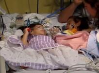 Formerly conjoined twins reunited for the first time