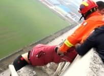 Firefighters save man from jumping off building in dramatic video