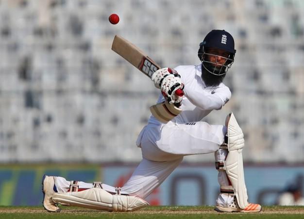 England batsman Moeen Ali plays a sweep shot during his unbeaten century on day one of the fifth Test match against India, December 16, 2016 Moeen Ali England