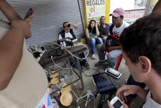 Residents use the internet via the free wifi and charge their mobile phone batteries