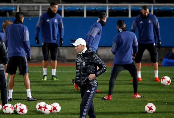 Real Madrid's head coach Zinedine Zidane (front) and players attend a training session ahead of the FIFA Club World Cup Final match against Kashima Antlers in Yokohama real madrid