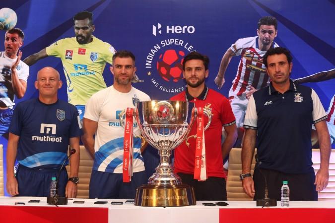 ISL 2016 finalist Kerala Blasters coach Steve Coppell and Aaron Hughes alongwith ATK's marquee Helder Postiga and coach Jose Molina pose for photographers at Pre-Final Press Conference isl 2016