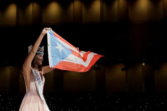 Miss Puerto Rico Stephanie Del Valle holds up the Puerto Rican flag after winning the Miss World 2016 Competition in Oxen Hill, Maryland, U.S., December 18, 2016. Miss World 2016