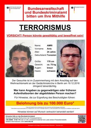 Handout wanted poster released on December 21, 2016 and acquired from the web site of the German Bundeskriminalamt (BKA) Federal Crime Office shows suspect Anis Amri searched in relation with the Monday's truck attack on a Christmas market in Berlin. The text reads: 'Terrorism. Attention! The person could be violent and armed. Reward up to 100,000 euro.' anis amri, berlin terror attack, christmas market berlin attack