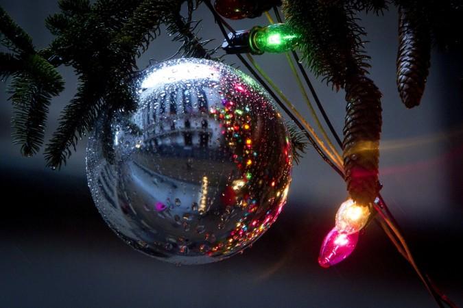The New York Stock Exchange is reflected in an ornamental ball on the last day of trading before Christmas in the Manhattan borough of New York. Christmas