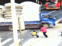 Chinese toddler miraculously escapes death after being run over by truck