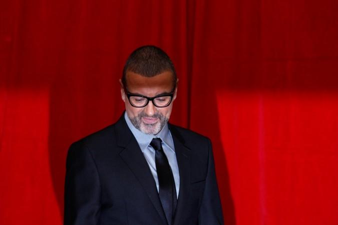 British singer George Michael poses for photographers before a news conference at the Royal Opera House in central London May 11, 2011 George Michael