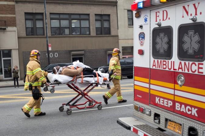 A man is stretchered after a commuter train derailed at Atlantic Terminal in Brooklyn, New York City, U.S. Brooklyn train accident