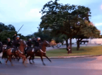 Watch the moment police on horseback charge and trample protesters in Brazil