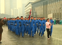 North Korean officials run through Pyongyang as part of national sports day