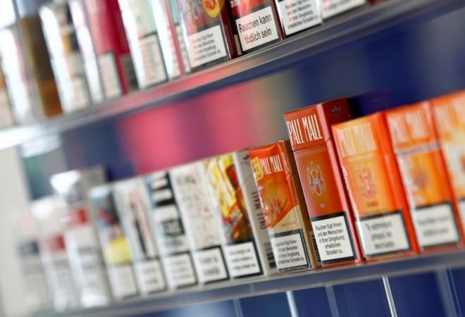 Pall Mall cigarettes are seen after the manufacturing process in the British American Tobacco Cigarette Factory (BAT) in Bayreuth, southern Germany, April 30, 2014. bat, reynolds, bat reynolds deal, reynolds cigarette, bat cigarette, itc share price, global cigarette consumption