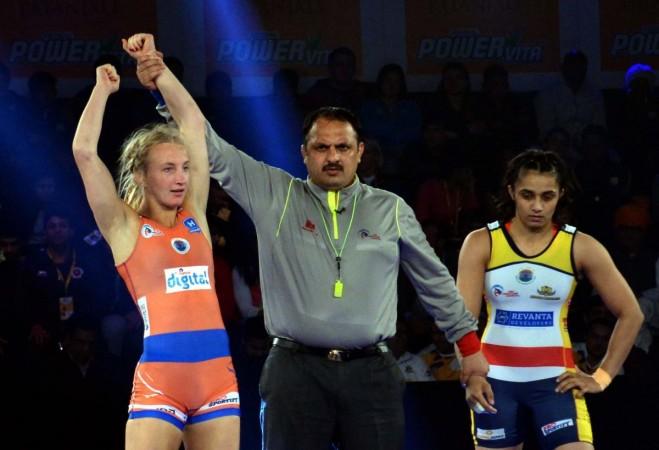 Sofia Mattsson of Haryana Hammers (In Orange) and Lalita of Mumbai Maharathi (In Blue) pro wrestling league