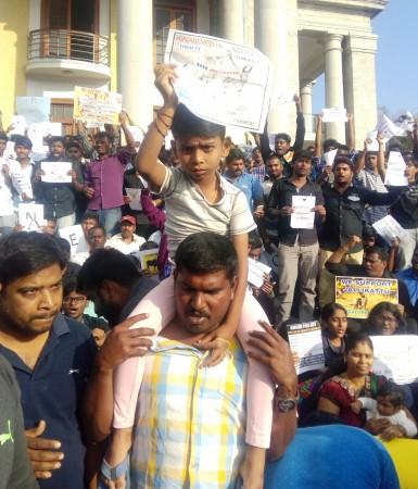 In picture: A young boy with his father participates in the protests against Jallikattu ban in Bengaluru on Thursday, January 19, 2017. Jallikattu protests in Bengaluru