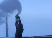 Sub-zero Alaskan temperatures instantly freeze water into snow