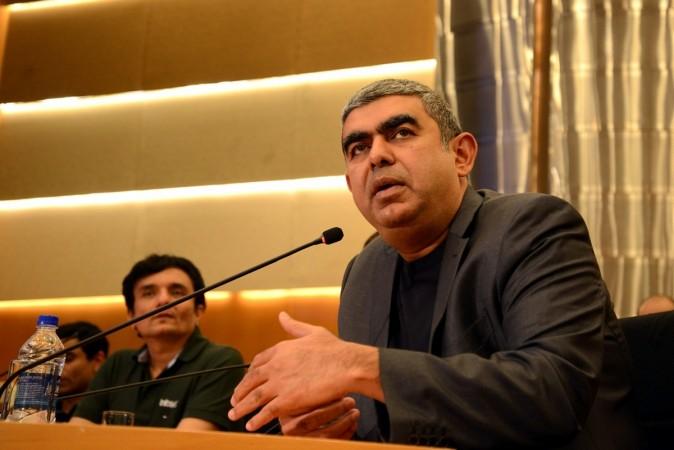 Infosys CEO Vishal Sikka announces the third quarter (October-December) results of fiscal 2016-17 in Bengaluru, on Jan 13, 2017. infosys to hire 10,000 americans, white house on infosys hiring, infosys ceo vishal sikka, infosys and h-1 b visa row, indian it companies