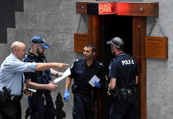 Australian police talk outside a bar where an actor was fatally wounded in the chest in Brisbane, Australia, January 23, 2017. Actor shot dead