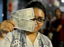 reliance mf, elss, budget 2017, demonetisation, remonetisation, note, bank note, rbi, currency bank, woman