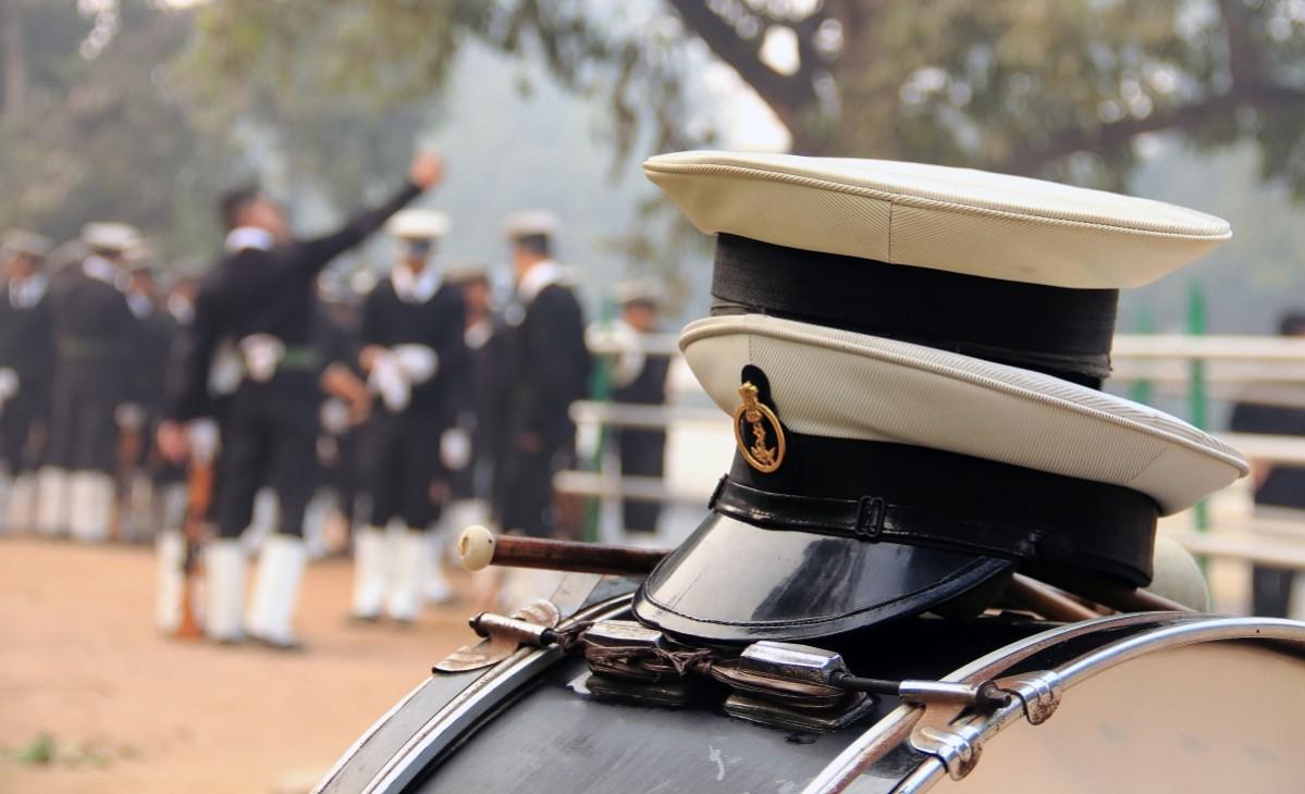 Hats off...after a marching session at 6am on a cold January morning, this Naval contingent takes a break for refreshments, chatting up and 'letting their hair down' Republic Day