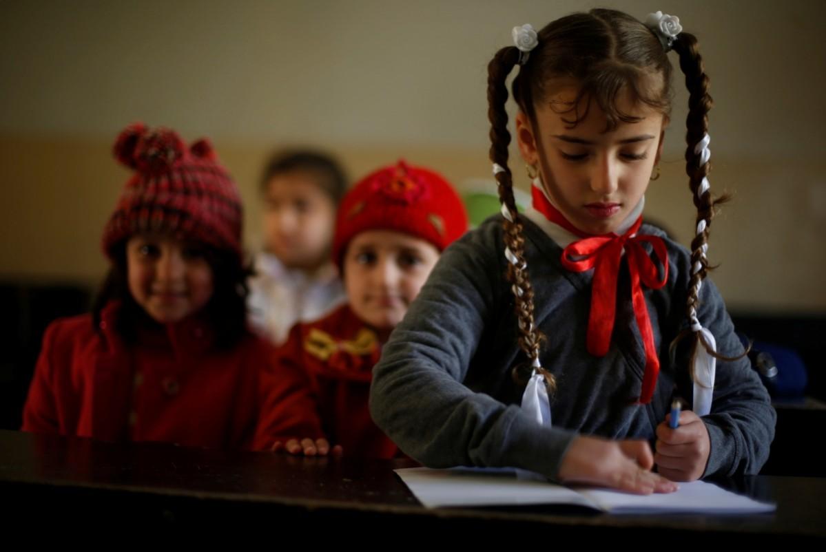 Schoolchildren attend class after registering in a school in Mosul, Iraq. Schools in Iraq's east Mosul are limping back to normalcy after two years under Islamic State rule when they were either closed or forced to teach a martial curriculum that included lessons in bomb-making. ISIS-affected children return to school in east Mosul, Iraq