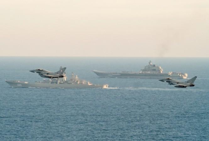 RAF Typhoons monitor Russian warships Pyotr Velikiy and the Admiral Kuznetsov (rear) as they pass close to UK territorial waters. Admiral Kuznetsov, Russian navy, Royal navy, Royal Air Force, NATO