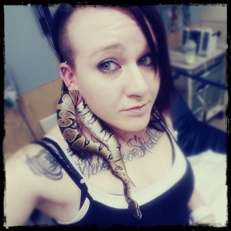 Pet snake is stuck in woman's earlobe Python