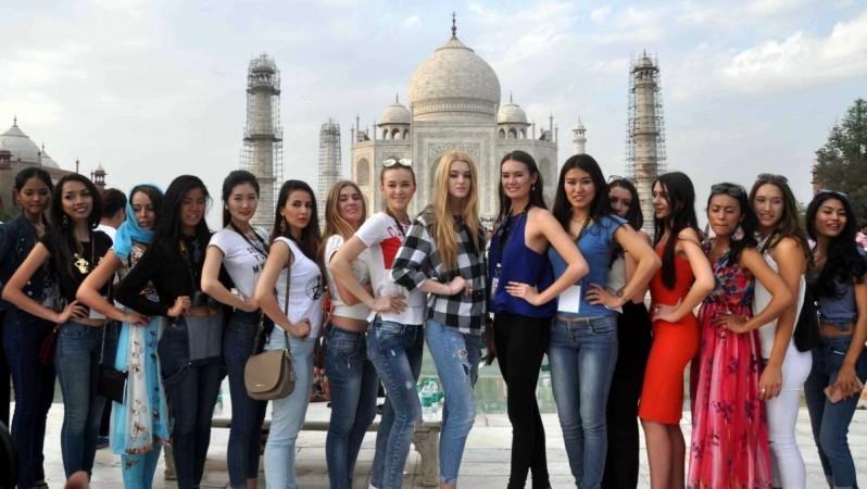 Uttar Pradesh is home to many monuments, including the world-famous Taj Mahal, which attract tourists from all over the world. Models from various nations visit the Taj Mahal in Agra, on March 18, 2016. tourism, fta in india, foreign tourists in india, tourism statistics, incredible india, modi govt, pm modi