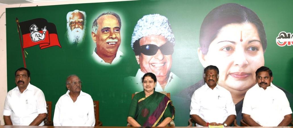 Sasikala Natarajan (centre), O Panneerselvam (second from right) and other AIADMK leaders at a party meeting. Sasikala Natarajan