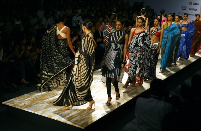 Models present creations by Indian designer Satya Paul's Spring/Summer 2009 collection at the Wills Lifestyle India Fashion Week in New Delhi October 17, 2008 (representational image). satya paul, genesis colors, genesis ipo, genesis colors listing, genesis colors promoters, genesis colors price band