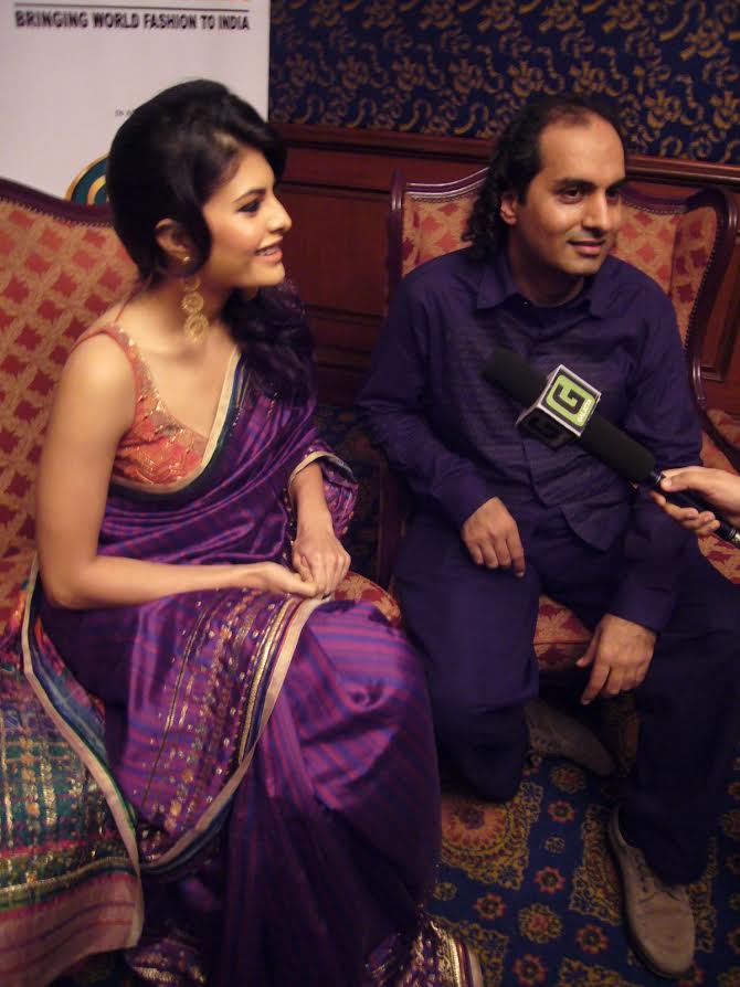 Model-actor Jacqueline Fernandes and designer Satya Paul at the Chennai Fashion International Week, 2009. satya paul, genesis colors, genesis ipo, genesis colors listing, genesis colors promoters, genesis colors price band