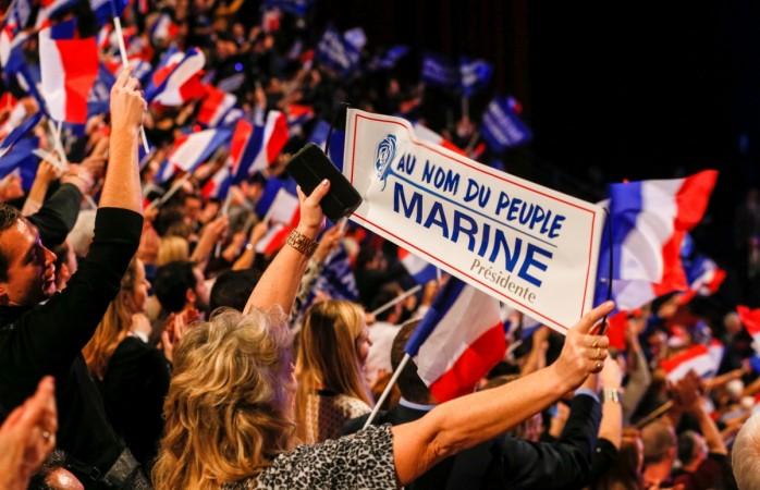 People cheer Marine Le Pen, French National Front (FN) leader and a candidate for the French 2017 presidential election, in Lyon, France, February 5, 2017. gold prices, global gold demand, france elections, french candidates, marine le pen, french elections, gold prices in india