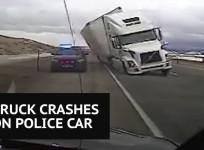 Wind blows truck onto Wyoming Highway Patrol Vehicle