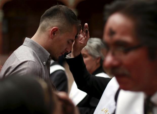 A man receives a cross of ashes during the traditional Ash Wednesday service, at the 20 de Julio Church in Bogota, Colombia February 10, 2016. A man receives a cross of ashes during the traditional Ash Wednesday service