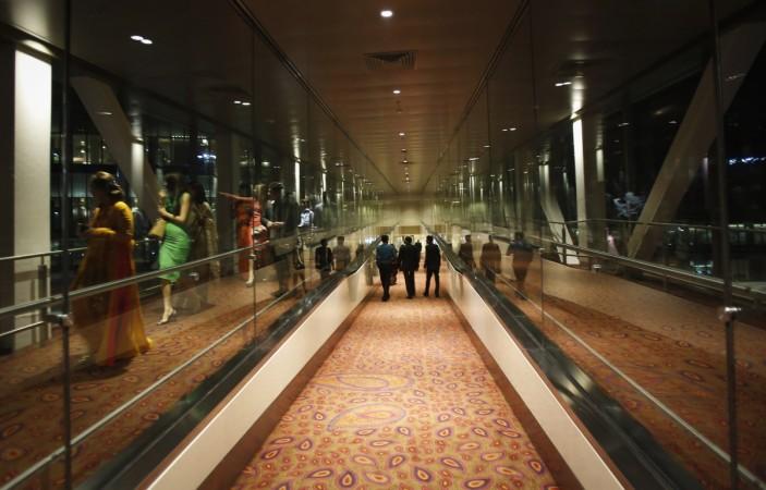 Guests walk inside an aerobridge at Terminal 2 at Chhatrapati Shivaji International Airport in Mumbai January 10, 2014. domestic air traffic jan 2017, domestic air traffic, india civil aviation, spicejet, indigo, air india, jet airways, zoom air, go air, airasia, vistara