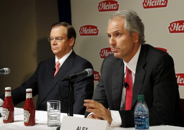 Alex Behring (R), Managing Partner at 3G Capital, talks as Heinz Chairman, President and CEO William R. Johnson listens during a news conference to announce that Heinz has agreed to be bought by Berkshire Hathaway and 3G Capital, in Pittsburgh, Pennsylvania February 14, 2013. kraft heinz news, 3g capital, gisele bundchen, kraft heinz bids for unilever, kraft heinz bids $143 billion for, 3g capital kraft heinz, fmcg company unilever