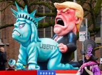 Carnival float in Düsseldorf shows Donald Trump assaulting Statue of Liberty