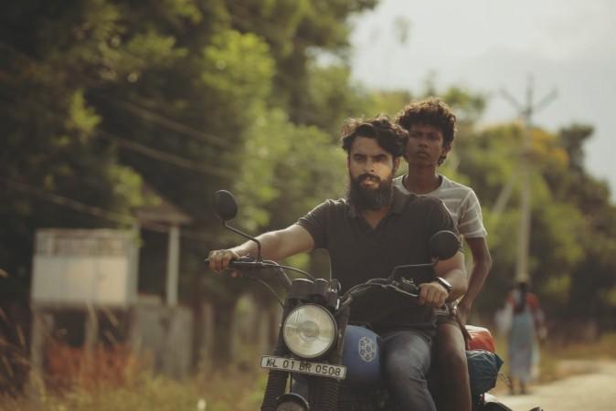 Tovino Thomas and Chethan Jayalal in the movie Guppy. Tovino Thomas, Chethan jayalal, Guppy